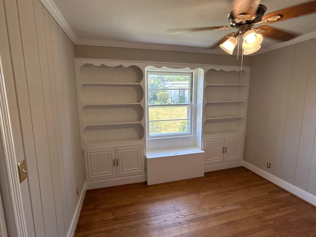 2210 Glendale Rd, Augusta, GA 30904 - empty room with crown molding, wooden walls, ceiling fan, and wood finished floors