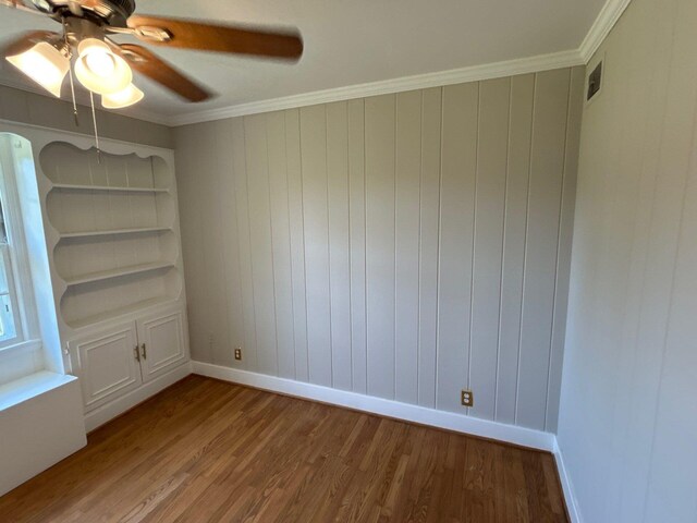 2210 Glendale Rd, Augusta, GA 30904 - spare room with visible vents, baseboards, ornamental molding, wood finished floors, and a ceiling fan
