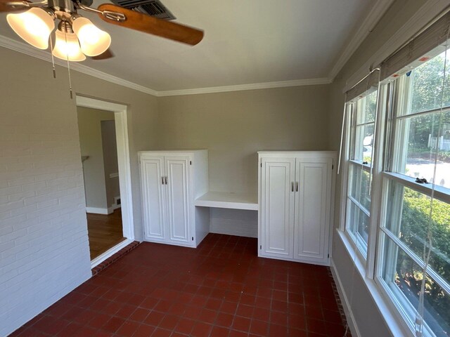 2210 Glendale Rd, Augusta, GA 30904 - spare room featuring ceiling fan, brick wall, crown molding, and visible vents