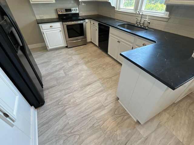 2210 Glendale Rd, Augusta, GA 30904 - kitchen featuring black dishwasher, dark countertops, backsplash, a sink, and stainless steel range with electric stovetop