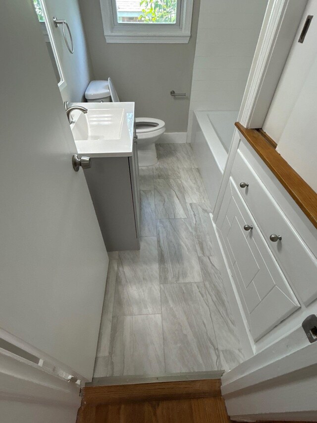 2210 Glendale Rd, Augusta, GA 30904 - full bath featuring vanity, toilet, marble finish floor, and baseboards