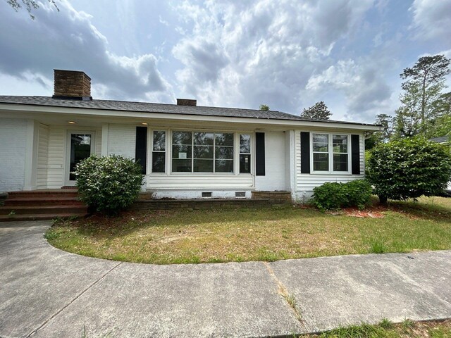 2210 Glendale Rd, Augusta, GA 30904 - ranch-style home featuring entry steps, a chimney, crawl space, a front lawn, and brick siding
