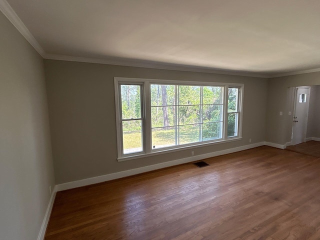 2210 Glendale Rd, Augusta, GA 30904 - unfurnished room with wood finished floors, crown molding, and baseboards