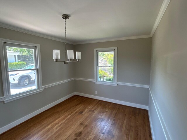 2210 Glendale Rd, Augusta, GA 30904 - interior space featuring dark wood-style floors, baseboards, a healthy amount of sunlight, and an inviting chandelier