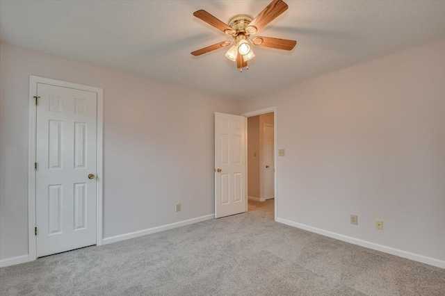 unfurnished bedroom with baseboards, ceiling fan, and carpet flooring