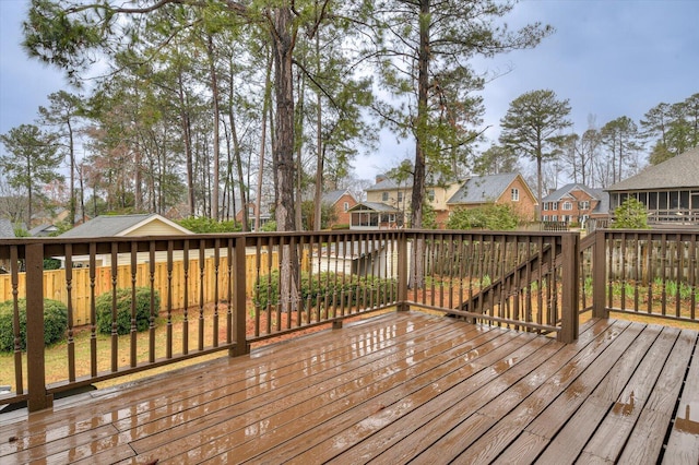 wooden terrace with a residential view