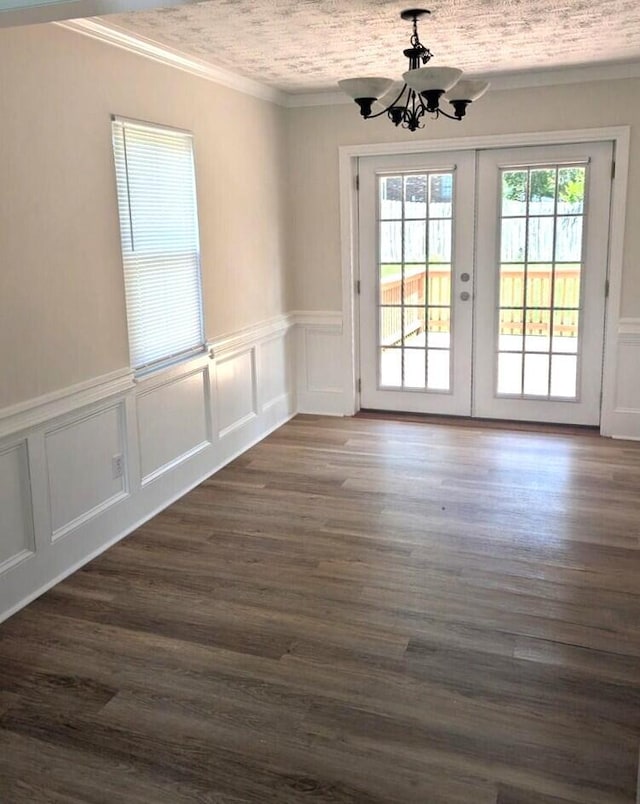 209 Biltmore Ct, Martinez, GA 30907 - unfurnished dining area featuring a chandelier, french doors, ornamental molding, a decorative wall, and wainscoting