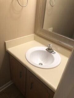 bathroom with tile patterned flooring and vanity