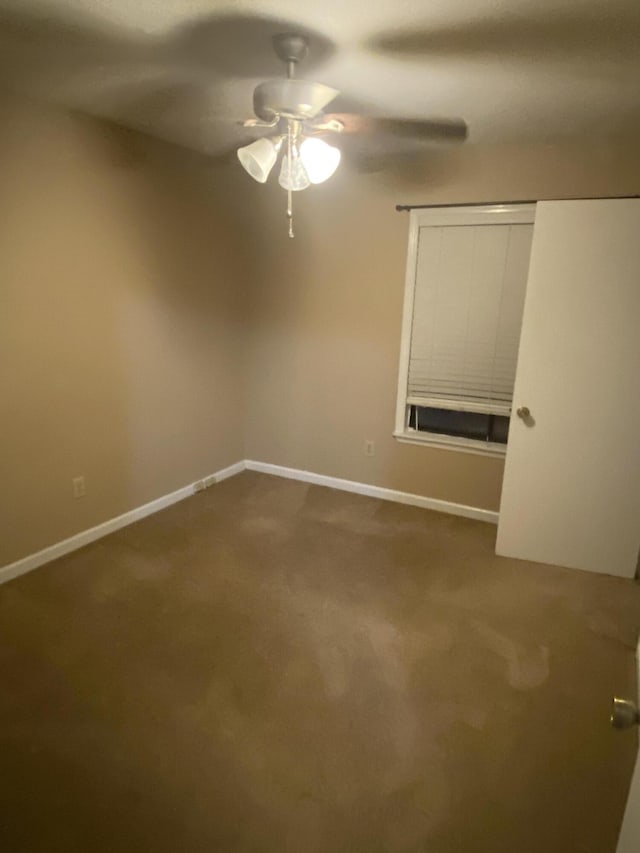 carpeted empty room with ceiling fan