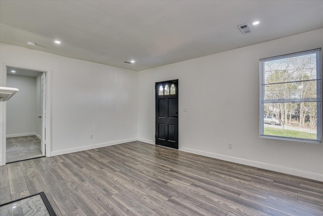 unfurnished room with hardwood / wood-style flooring