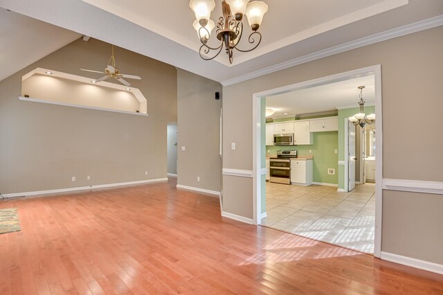 790 Osprey Ln, Martinez, GA 30907 - spare room featuring a chandelier, ornamental molding, light wood finished floors, ceiling fan, and baseboards