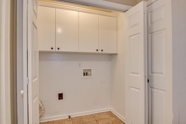 790 Osprey Ln, Martinez, GA 30907 - laundry room with hookup for an electric dryer, cabinet space, hookup for a washing machine, light tile patterned floors, and baseboards