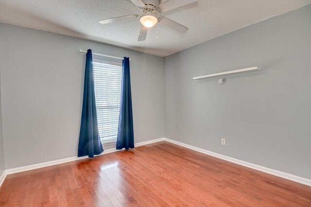 790 Osprey Ln, Martinez, GA 30907 - unfurnished room featuring ceiling fan, wood finished floors, baseboards, and a textured ceiling