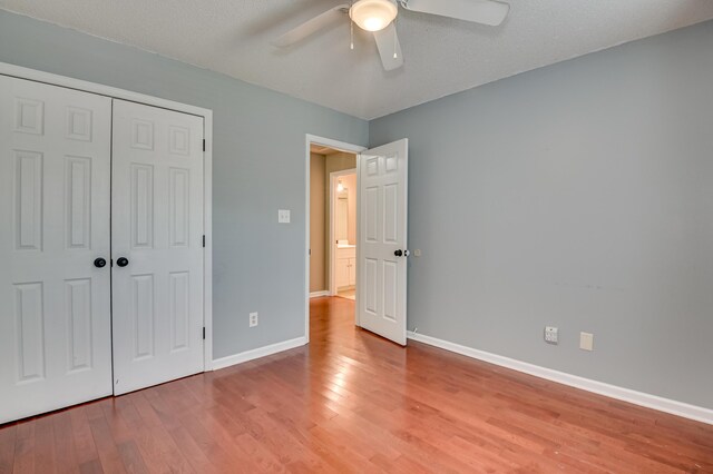 790 Osprey Ln, Martinez, GA 30907 - unfurnished bedroom with light wood finished floors, baseboards, a closet, and ceiling fan
