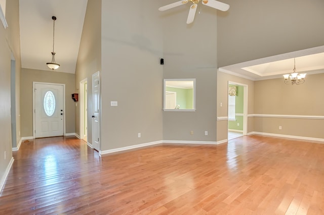 790 Osprey Ln, Martinez, GA 30907 - entrance foyer with a high ceiling, a chandelier, light wood-style floors, baseboards, and ceiling fan
