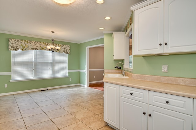 790 Osprey Ln, Martinez, GA 30907 - kitchen featuring a sink, light tile patterned floors, a chandelier, plenty of natural light, and ornamental molding