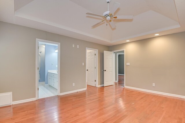 790 Osprey Ln, Martinez, GA 30907 - spare room featuring a raised ceiling, ceiling fan, light wood-style flooring, recessed lighting, and baseboards