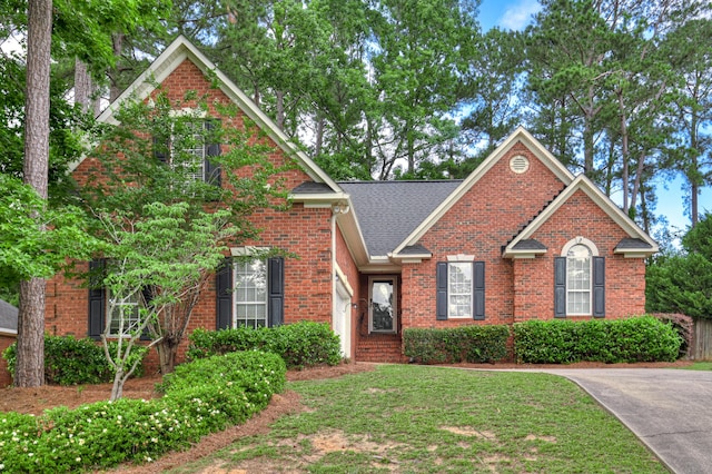 790 Osprey Ln, Martinez, GA 30907 - traditional home featuring brick siding, a front yard, and roof with shingles
