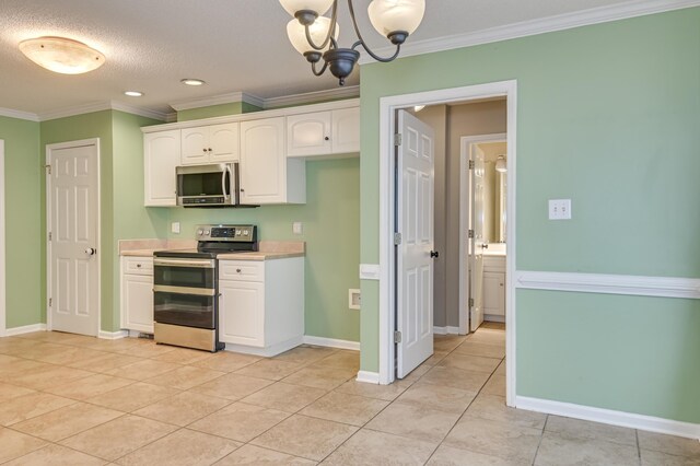 790 Osprey Ln, Martinez, GA 30907 - kitchen with stainless steel appliances, ornamental molding, white cabinetry, light countertops, and light tile patterned floors
