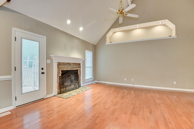 790 Osprey Ln, Martinez, GA 30907 - unfurnished living room with ceiling fan, high vaulted ceiling, wood finished floors, a stone fireplace, and recessed lighting