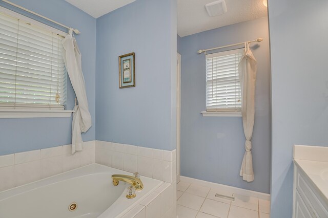 790 Osprey Ln, Martinez, GA 30907 - full bathroom featuring a whirlpool tub, vanity, tile patterned floors, baseboards, and a shower