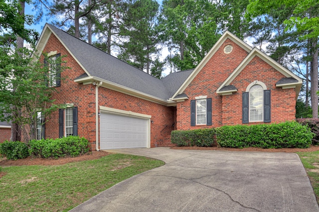 790 Osprey Ln, Martinez, GA 30907 - traditional home featuring brick siding, roof with shingles, driveway, and a garage