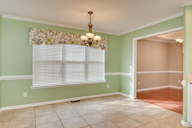 790 Osprey Ln, Martinez, GA 30907 - unfurnished dining area with a chandelier, crown molding, tile patterned flooring, and baseboards