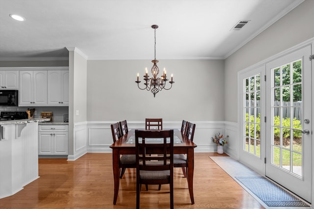 1109 Highmoor Ln, Evans, GA 30809 - dining space featuring a chandelier, light wood finished floors, wainscoting, crown molding, and recessed lighting