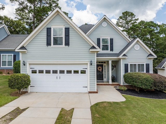1109 Highmoor Ln, Evans, GA 30809 - traditional home featuring driveway, an attached garage, a front yard, covered porch, and a shingled roof