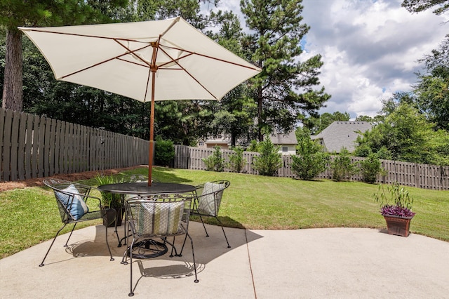 1109 Highmoor Ln, Evans, GA 30809 - fenced backyard featuring a patio area and outdoor dining area