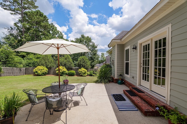 1109 Highmoor Ln, Evans, GA 30809 - fenced backyard featuring a patio and outdoor dining space