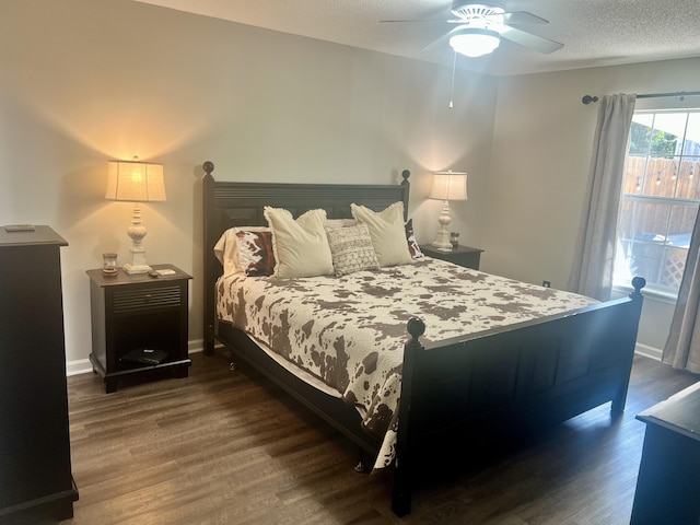 bedroom featuring ceiling fan and dark wood-type flooring