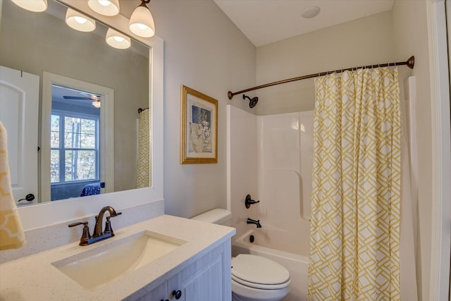 bathroom with shower / tub combo, vanity, and toilet