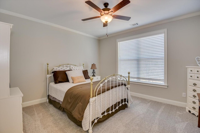 bedroom with visible vents, baseboards, crown molding, and light colored carpet