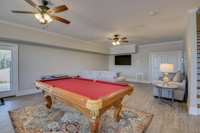 playroom featuring ornamental molding, visible vents, and light wood-style flooring