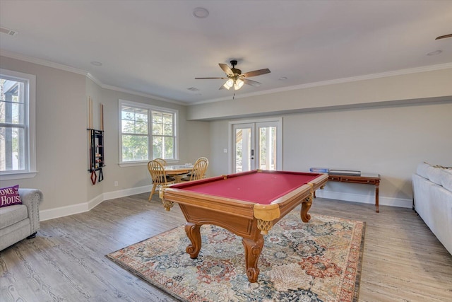 rec room with light wood finished floors, a wealth of natural light, and french doors