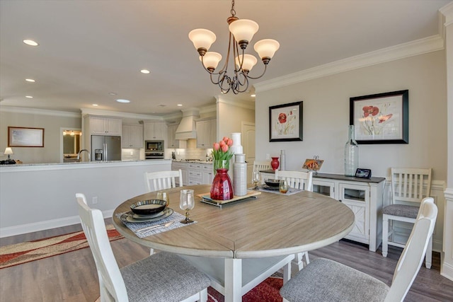 dining area featuring ornamental molding, recessed lighting, a chandelier, and dark wood finished floors