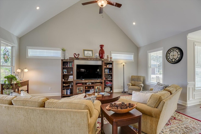 living room with recessed lighting, ceiling fan, wood finished floors, high vaulted ceiling, and baseboards