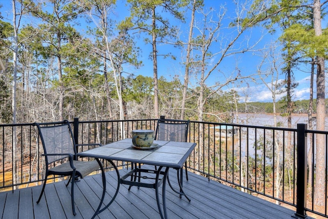 wooden deck featuring outdoor dining space