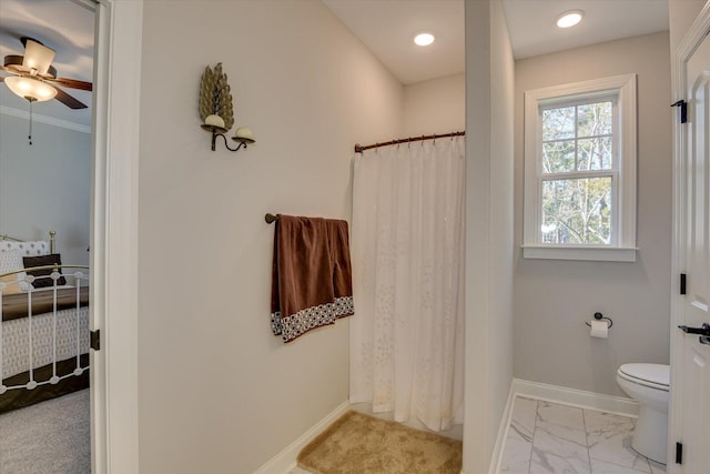 bathroom featuring toilet, a ceiling fan, baseboards, marble finish floor, and a shower with curtain