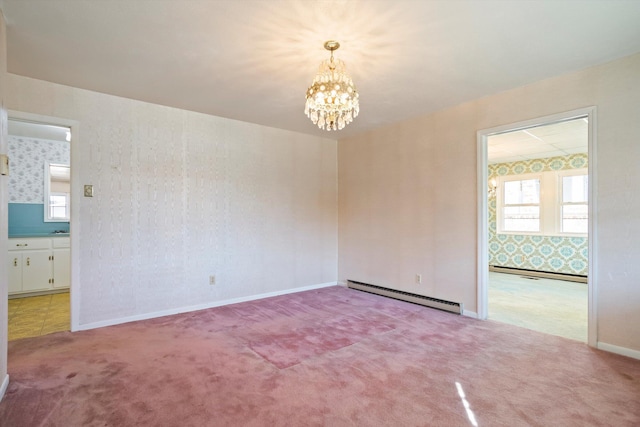 unfurnished room featuring carpet floors, a baseboard radiator, and an inviting chandelier