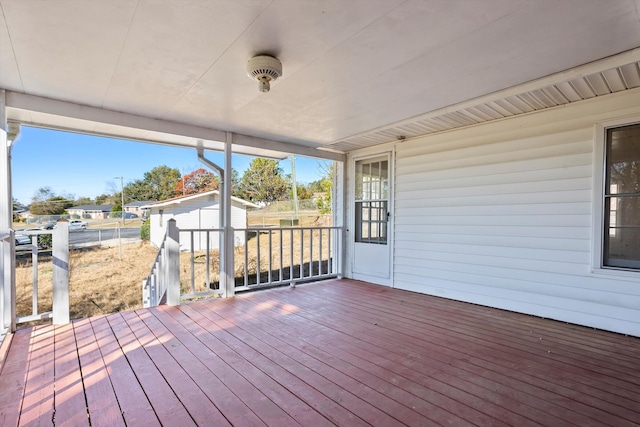 deck with a storage shed