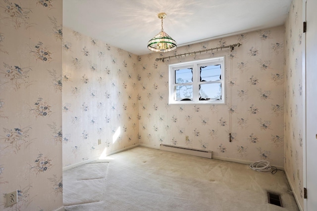 unfurnished room featuring carpet floors and a baseboard heating unit