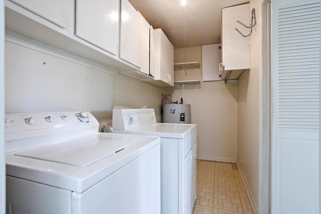 washroom featuring washer and dryer, cabinets, and electric water heater