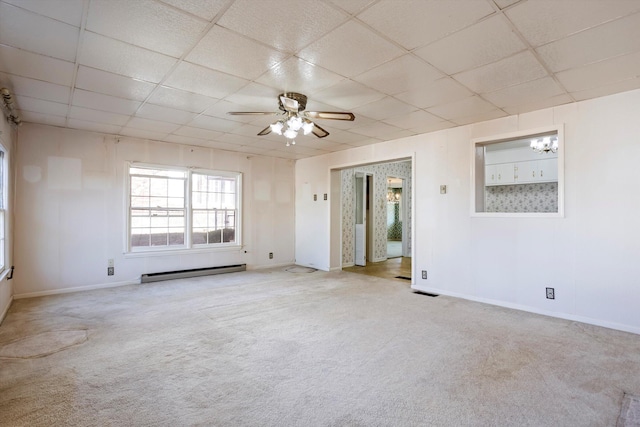 carpeted spare room featuring a paneled ceiling, ceiling fan, and a baseboard radiator