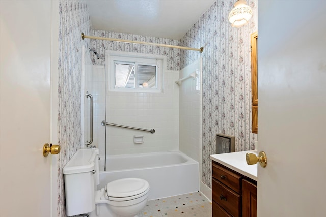 full bathroom featuring tile patterned flooring, vanity, toilet, and tiled shower / bath combo