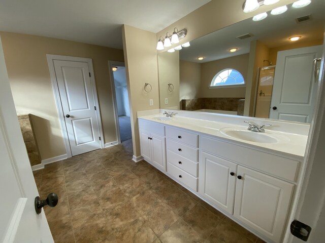 bathroom with vanity and a shower with door