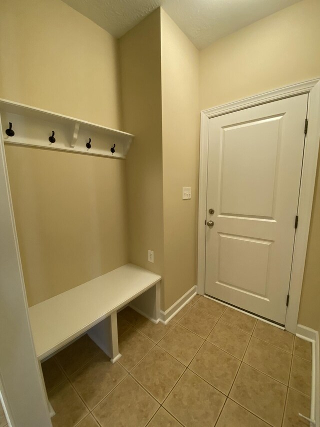 mudroom featuring light tile patterned floors