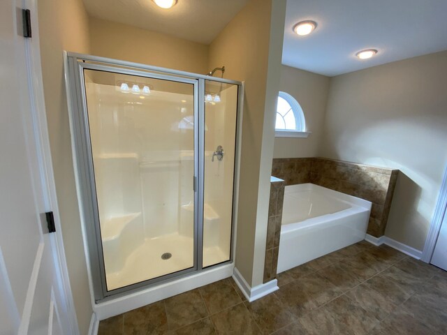 bathroom with shower with separate bathtub