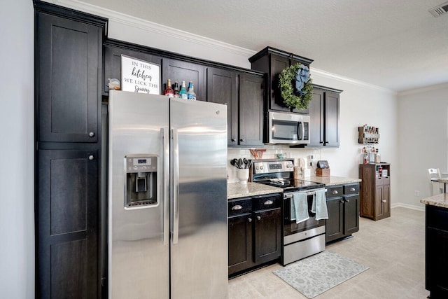 329 Baylor Dr, Graniteville, SC 29829 - kitchen with appliances with stainless steel finishes, ornamental molding, and light stone counters